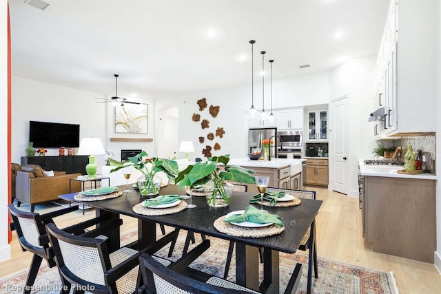 dining area featuring ceiling fan and light hardwood / wood-style floors