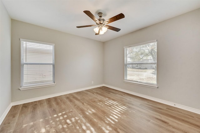 spare room with light hardwood / wood-style flooring and ceiling fan