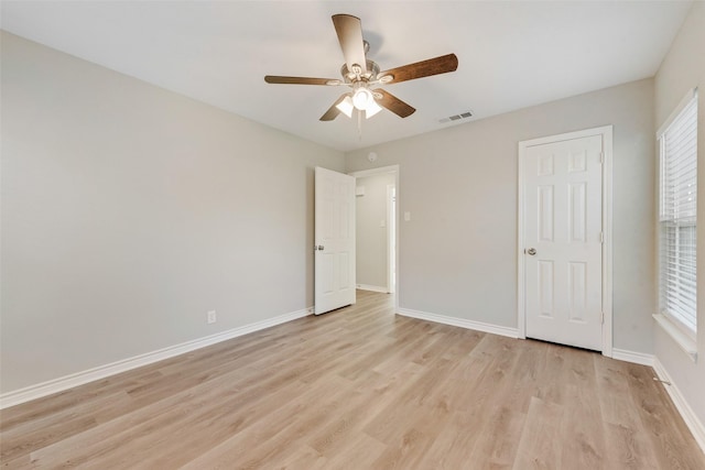 unfurnished bedroom with ceiling fan and light hardwood / wood-style flooring