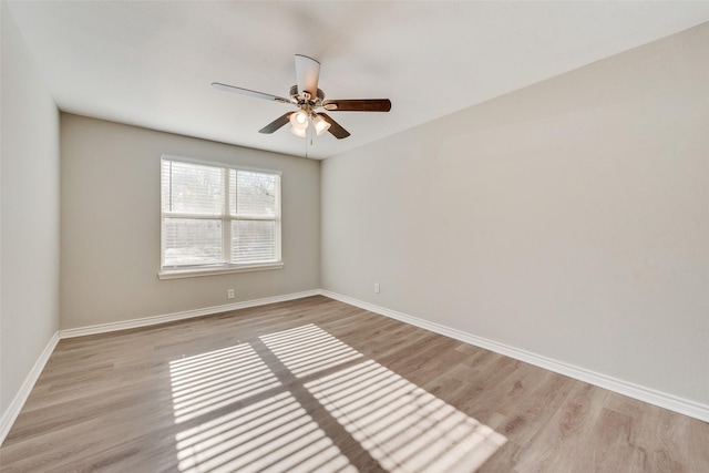 unfurnished room with ceiling fan and light hardwood / wood-style flooring