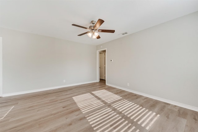 unfurnished room featuring light hardwood / wood-style flooring and ceiling fan