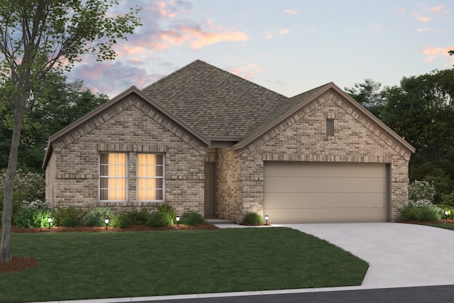 view of front facade featuring a yard and a garage