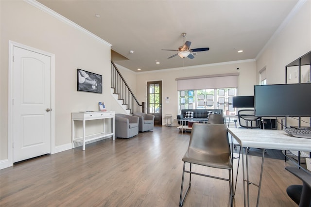 office space featuring ceiling fan, hardwood / wood-style floors, and ornamental molding