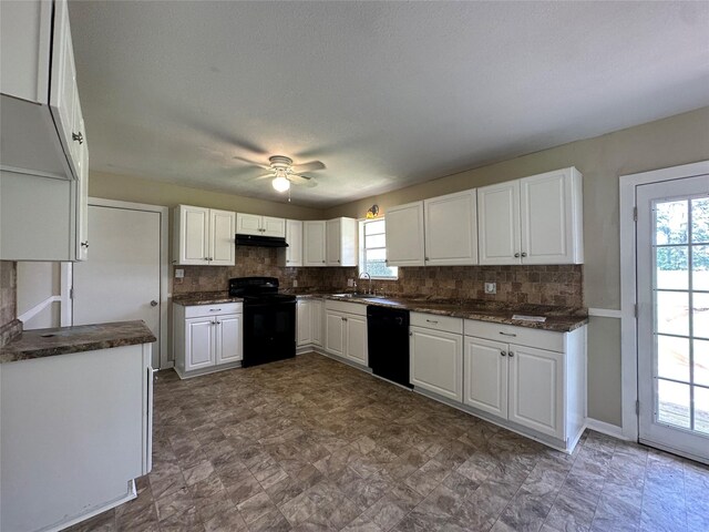 kitchen featuring tasteful backsplash, sink, white cabinets, and black appliances