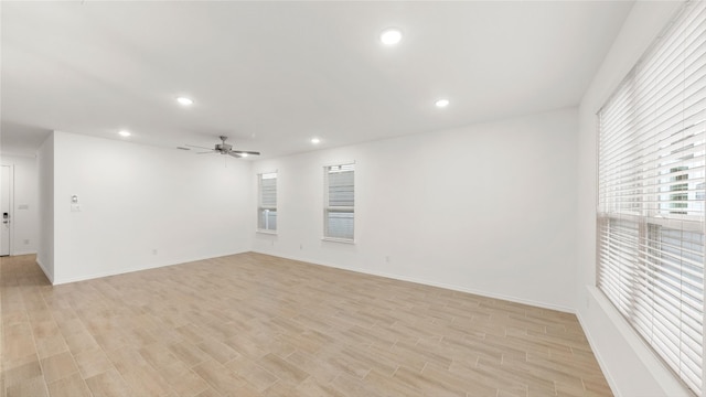 unfurnished room with light wood-style floors, recessed lighting, ceiling fan, and baseboards