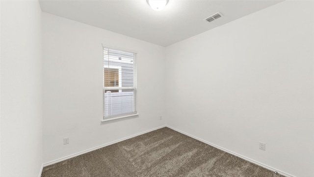 empty room with carpet flooring