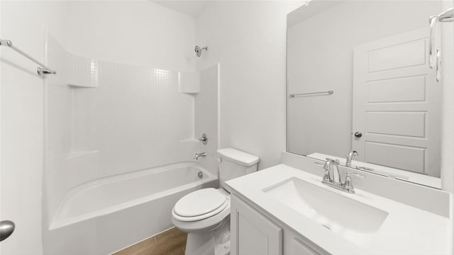 full bath featuring  shower combination, wood finished floors, vanity, and toilet