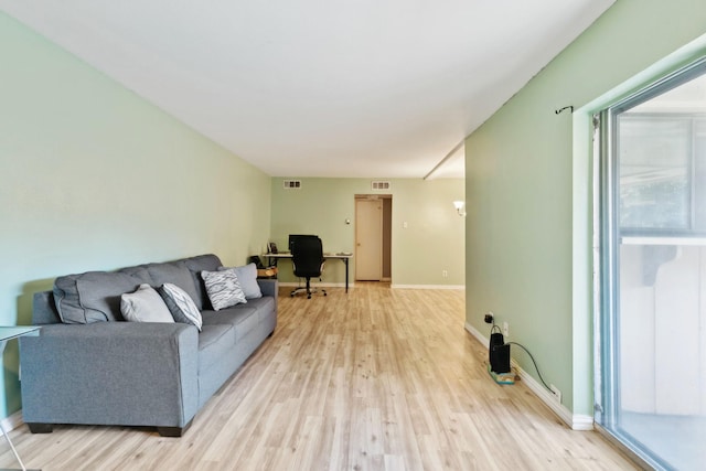 living room featuring light wood-type flooring