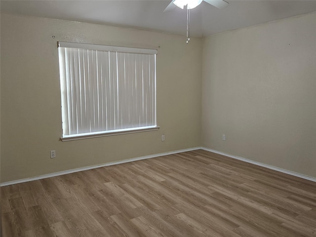 unfurnished room featuring hardwood / wood-style flooring and ceiling fan