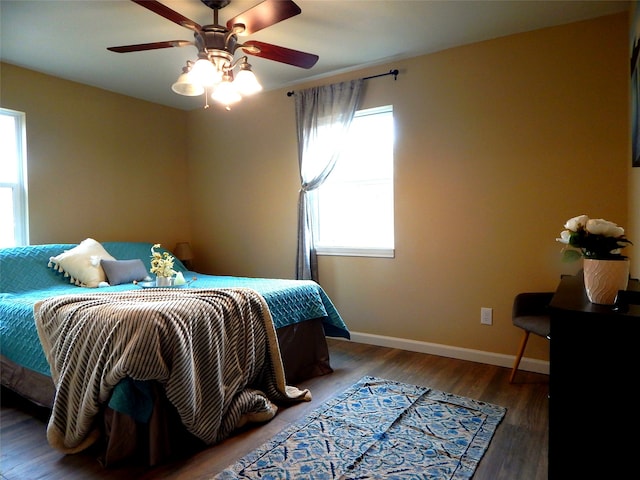 bedroom featuring wood-type flooring and ceiling fan