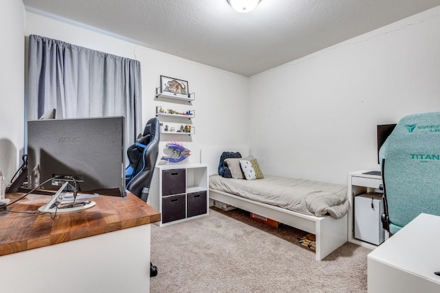 carpeted bedroom featuring a textured ceiling