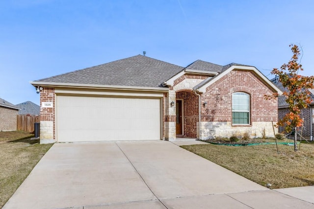 ranch-style house with a garage and a front lawn