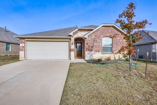 single story home featuring a front lawn and a garage