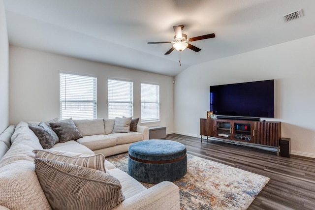 living room with dark hardwood / wood-style floors, vaulted ceiling, and ceiling fan