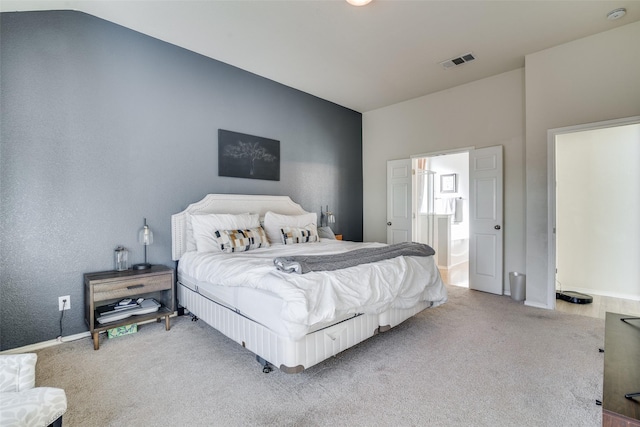 carpeted bedroom featuring vaulted ceiling