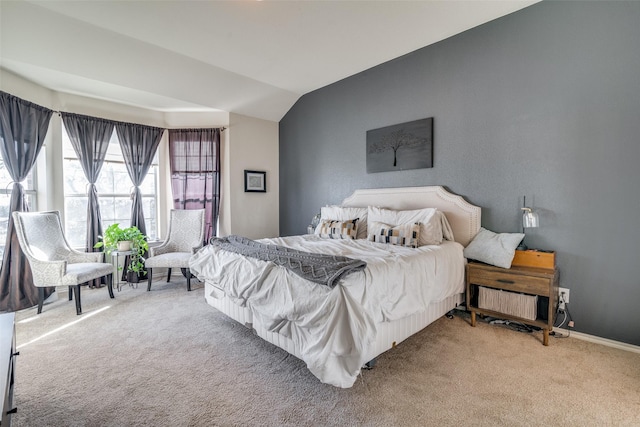 carpeted bedroom featuring vaulted ceiling