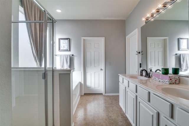 bathroom featuring tile patterned floors, vanity, and independent shower and bath