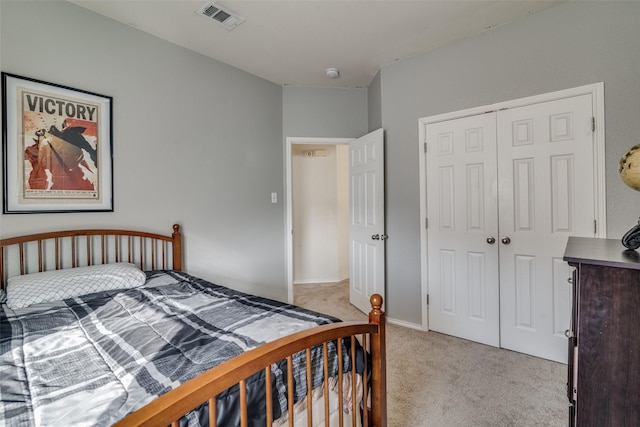 carpeted bedroom with a closet