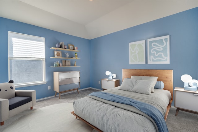 carpeted bedroom with vaulted ceiling