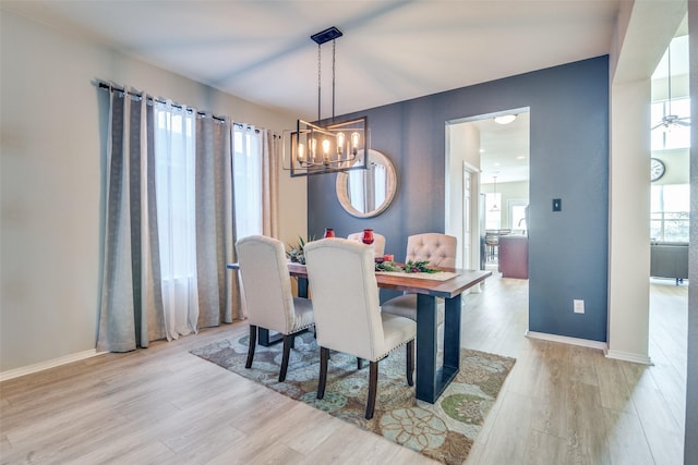 dining area featuring a healthy amount of sunlight and light hardwood / wood-style floors