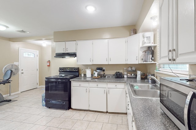 kitchen featuring white cabinetry, sink, light tile patterned floors, and black range with electric cooktop