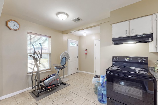 kitchen featuring white cabinets, black electric range oven, and light tile patterned floors