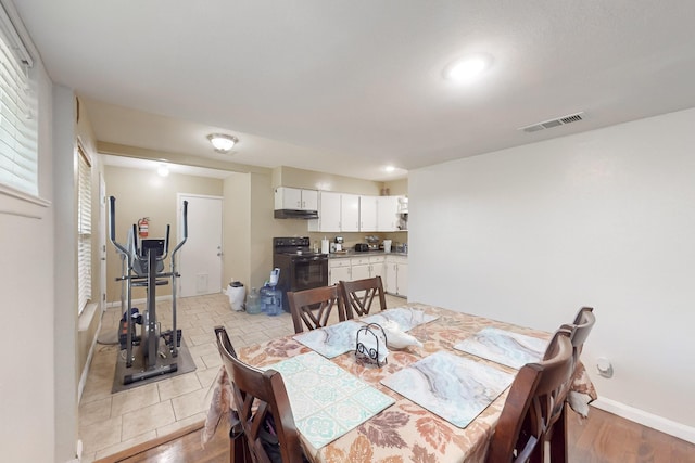 dining space featuring light hardwood / wood-style flooring