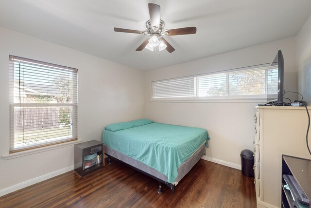 bedroom featuring ceiling fan and dark wood-type flooring