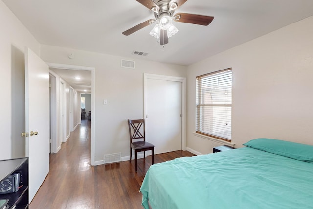 bedroom featuring dark hardwood / wood-style floors and ceiling fan