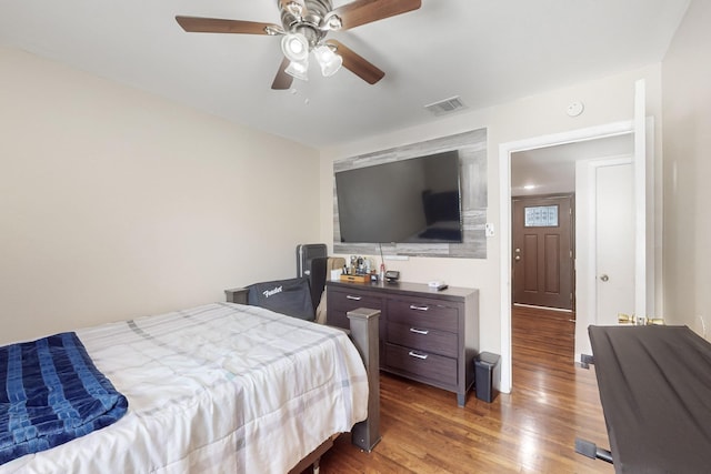 bedroom with wood-type flooring and ceiling fan