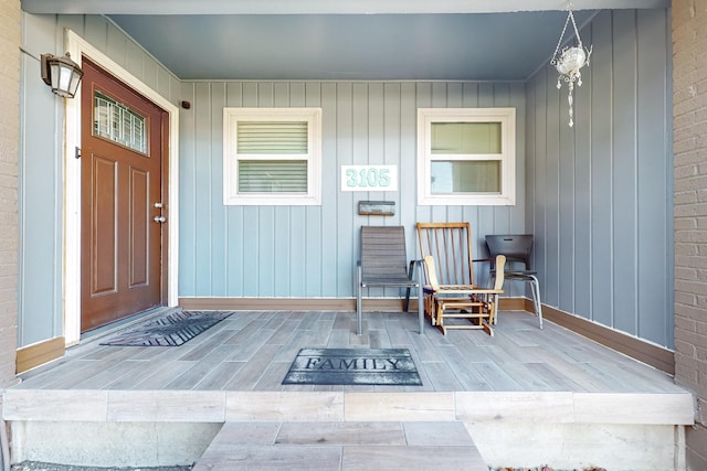 entrance to property featuring a porch