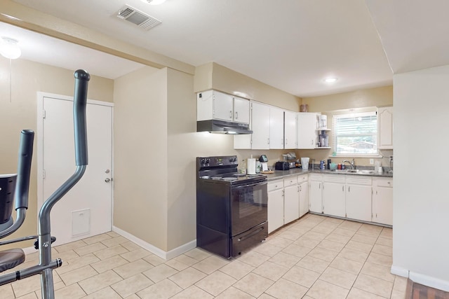 kitchen featuring electric range, white cabinetry, and sink