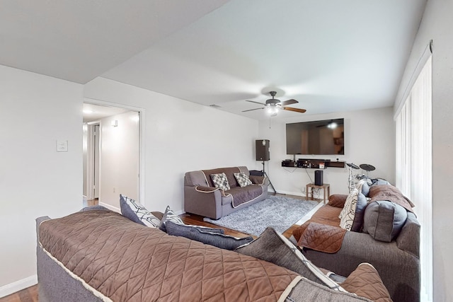 living room featuring hardwood / wood-style flooring and ceiling fan