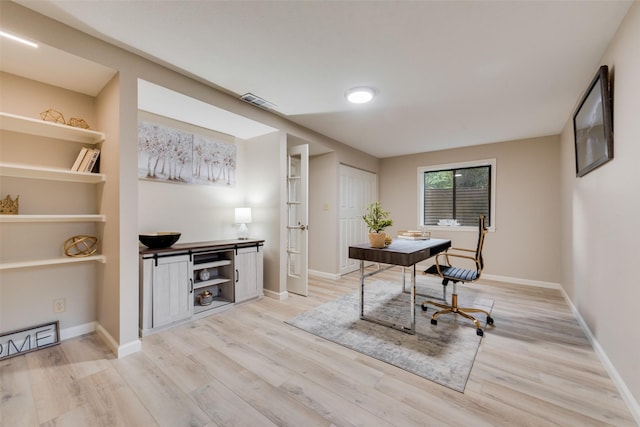 office featuring french doors and light wood-type flooring