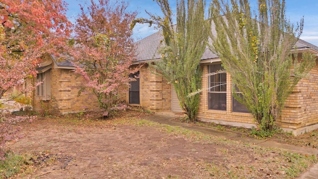 view of property hidden behind natural elements