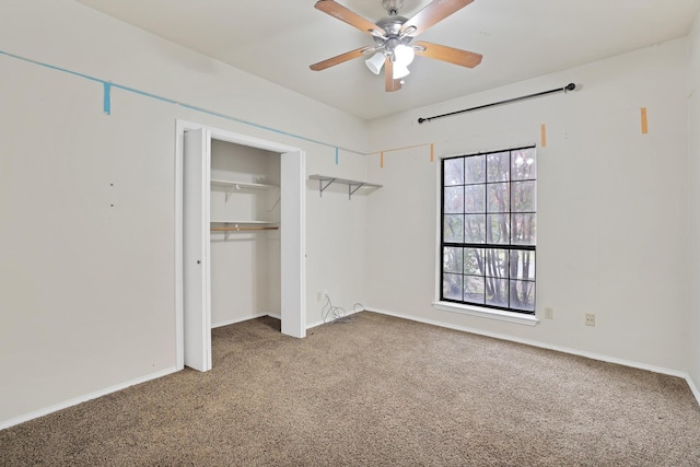 unfurnished bedroom featuring carpet floors, ceiling fan, and a closet