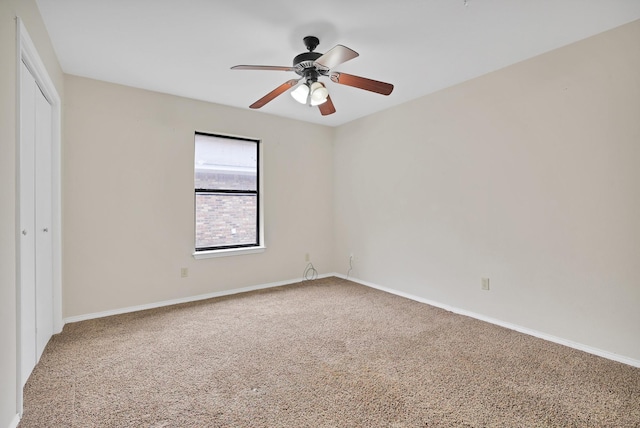 carpeted empty room with ceiling fan