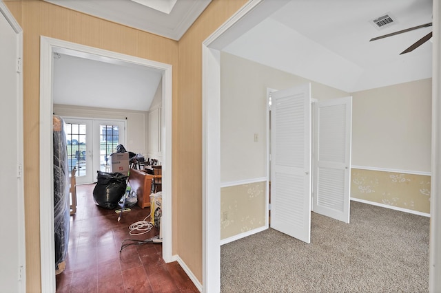 hall featuring lofted ceiling and french doors