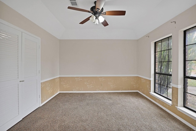 interior space with ceiling fan