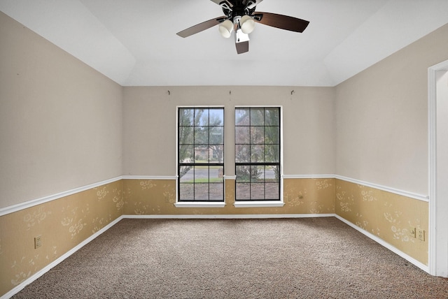 unfurnished room featuring vaulted ceiling, ceiling fan, and carpet floors