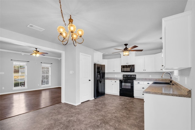 kitchen featuring ceiling fan with notable chandelier, black appliances, white cabinetry, sink, and hanging light fixtures