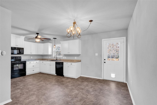 kitchen featuring ceiling fan with notable chandelier, black appliances, white cabinetry, sink, and hanging light fixtures