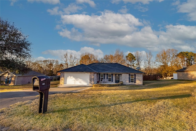 ranch-style home featuring a front lawn and a garage