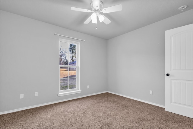 carpeted empty room featuring ceiling fan