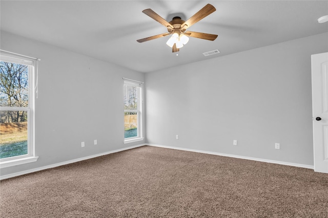 carpeted empty room with ceiling fan