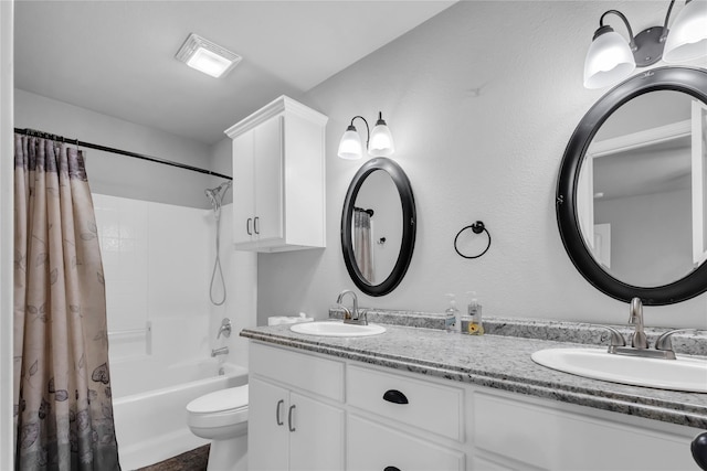 full bathroom with shower / bath combo with shower curtain, toilet, and vanity