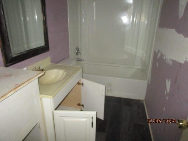 bathroom with shower / bathing tub combination and vanity