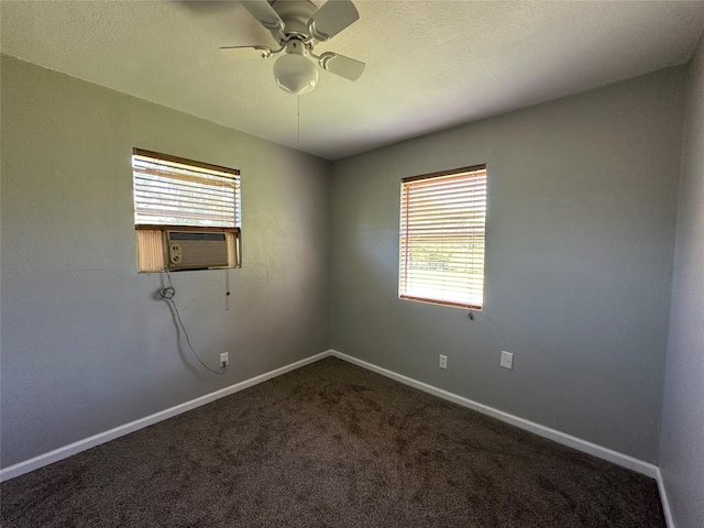 spare room featuring cooling unit, ceiling fan, plenty of natural light, and carpet