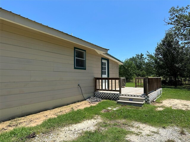 view of side of property with a deck