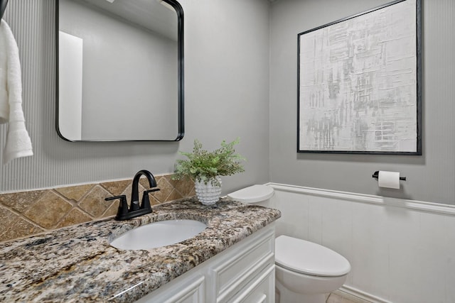 bathroom with vanity and toilet